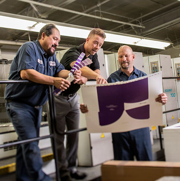 Dynagraphic employees inspecting work